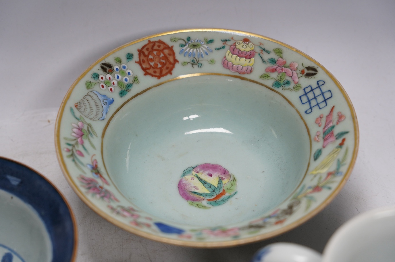 A Chinese blue and white Ming dynasty bowl, a blue and white mug and two pieces of famille rose (4), tallest 12cm. Condition - good